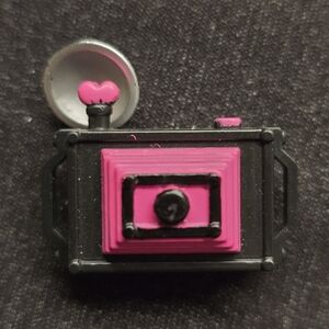 Camera accessory for a Monster High Draculaura Doll